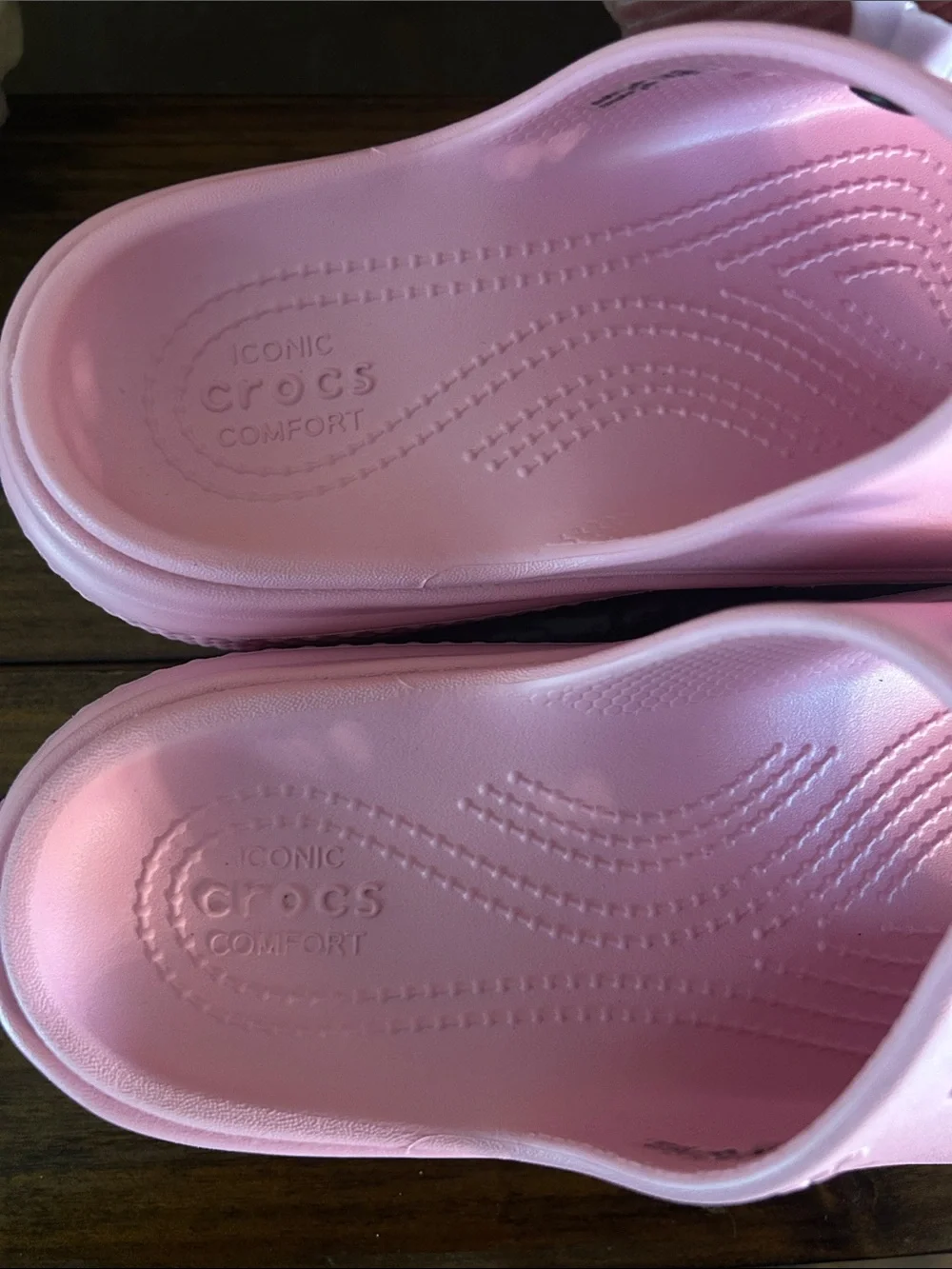 Crocs Pink stomp slides with charms
